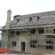 A half built building with a chimney on it